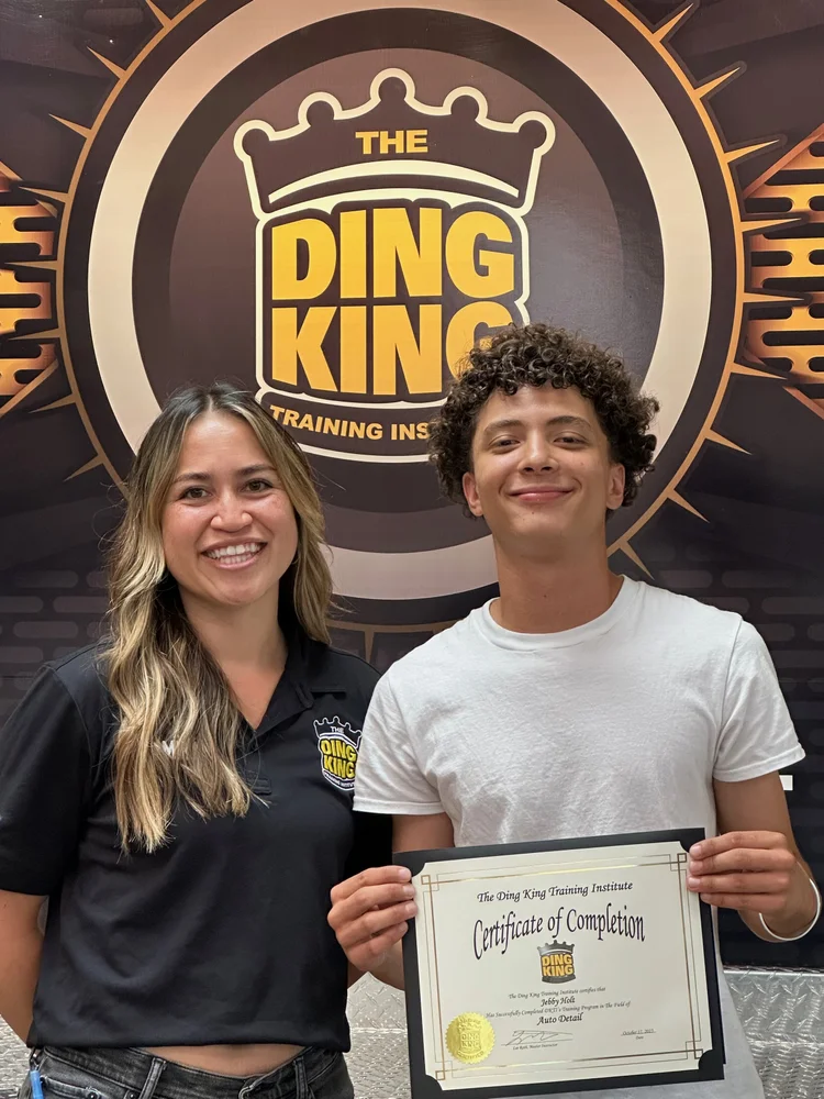 Jebby Holt of Crystal Clean receiving a professional training certificate of completion from Ding King for expert Car Detailing Durango CO.